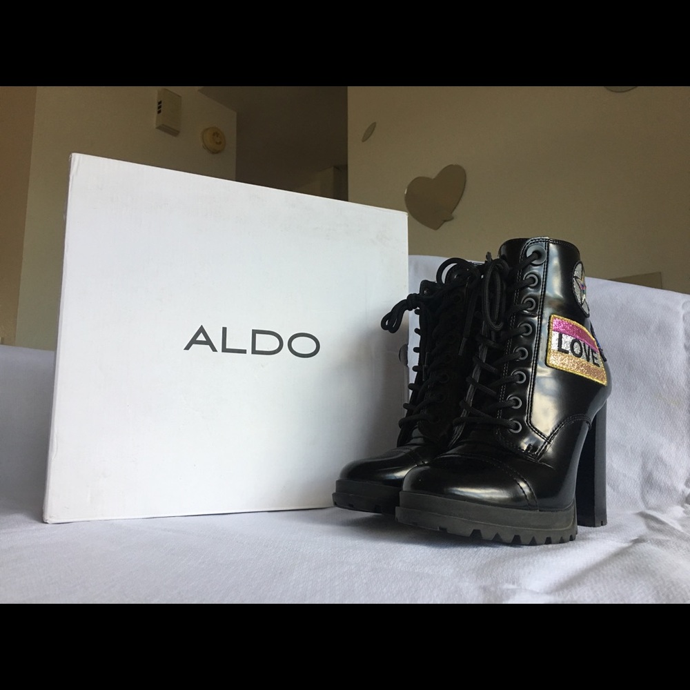 Black ALDO boots with patches on sides